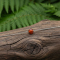 Collana con sfera in pietra naturale