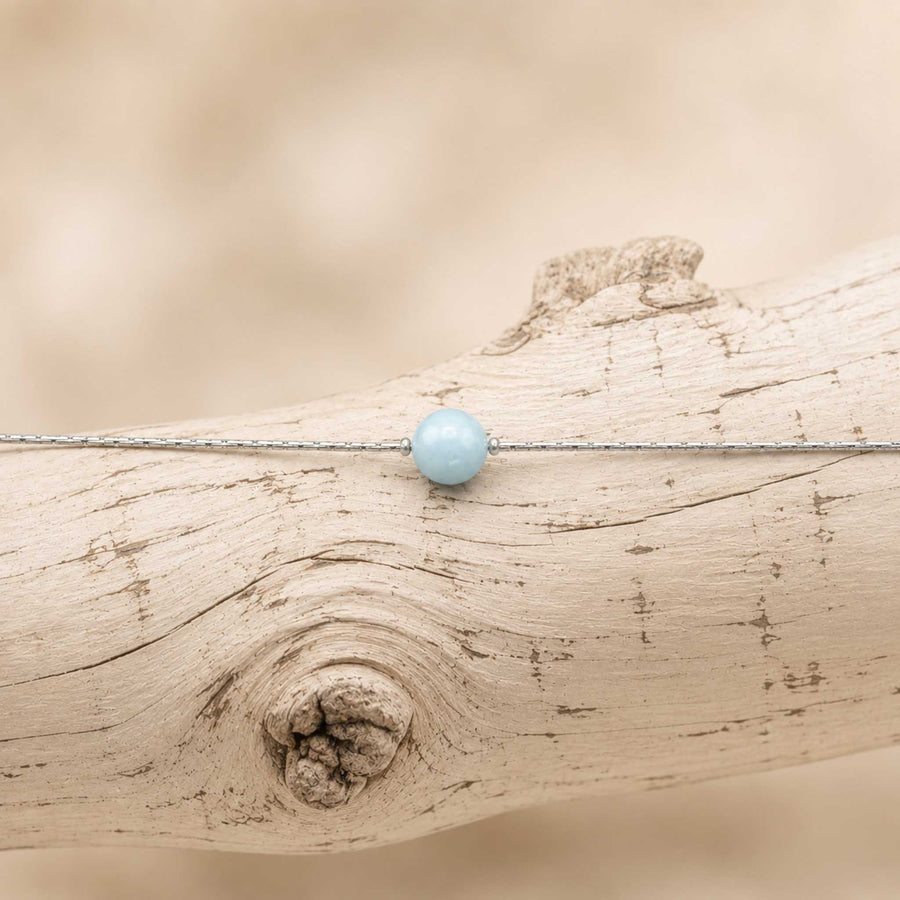 Collana con sfera in pietra naturale